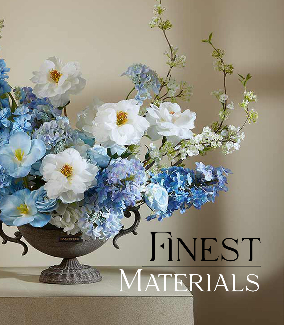Elegant artificial flower arrangement with white peonies, blue hydrangeas and tulips in ornate dark metal urn