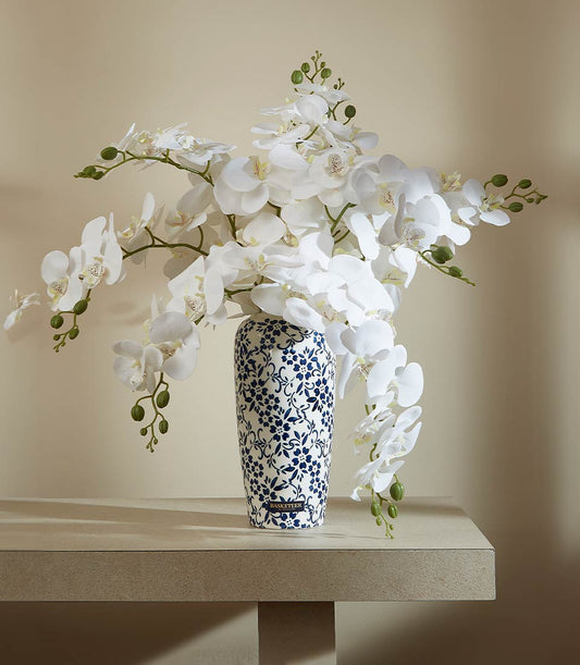White orchid artificial flower arrangement in blue-patterned vase, luxury gift