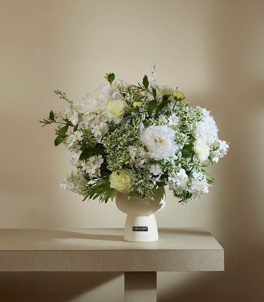 Cream vase with white and soft yellow artificial peonies, ideal for gifting or home décor