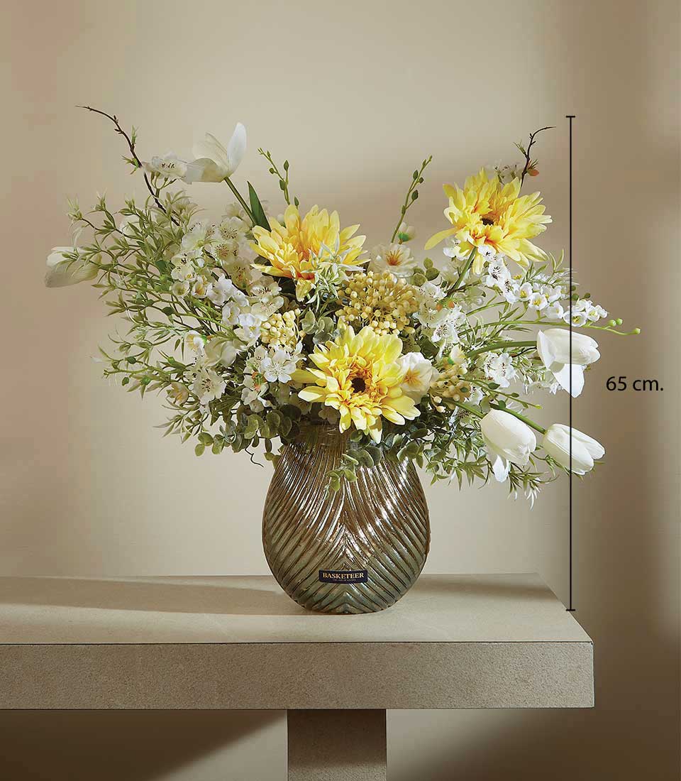 Vibrant yellow dahlia and white tulip artificial flower arrangement in ribbed iridescent glass vase