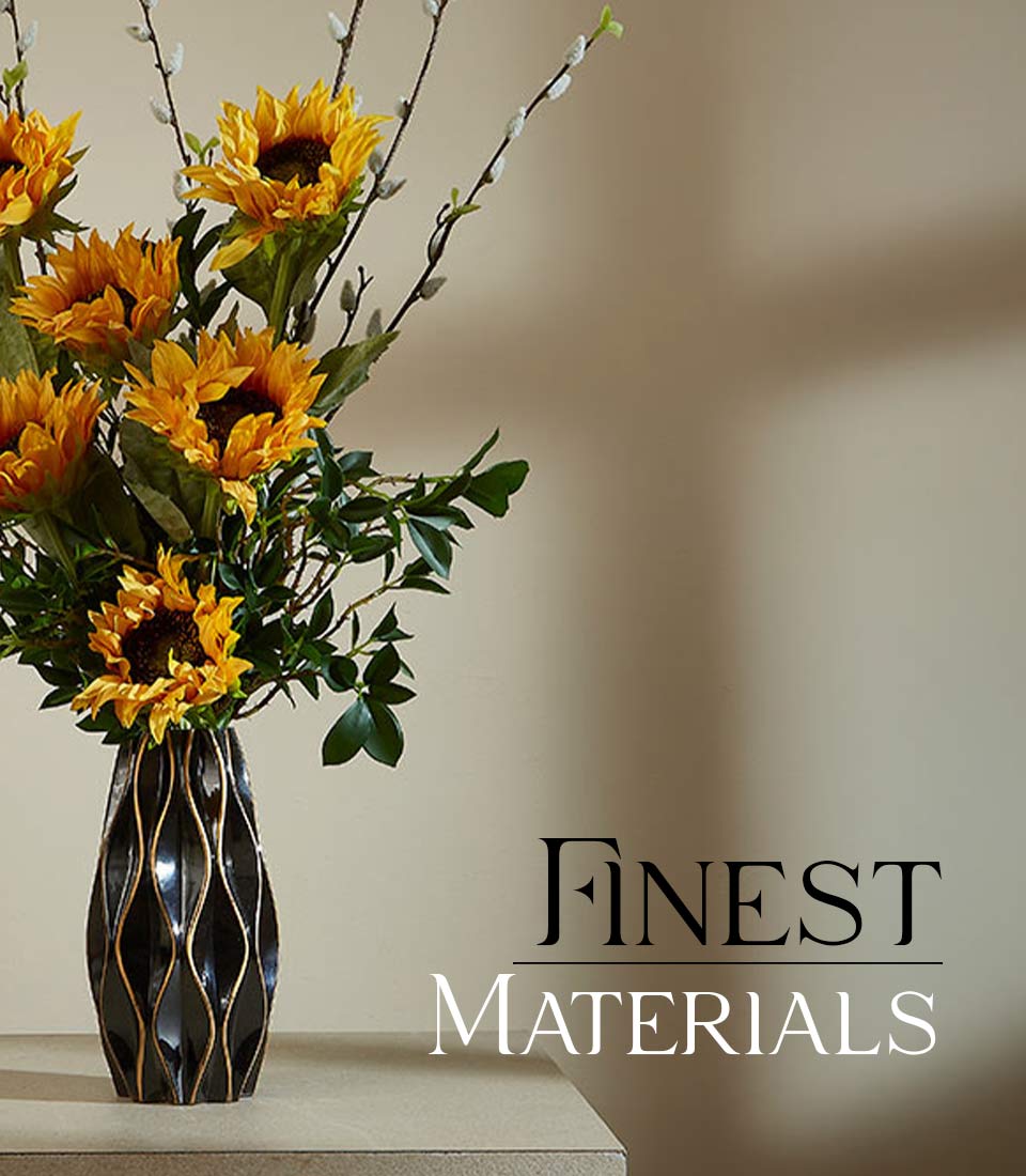 Bright yellow sunflower artificial flower arrangement in black ceramic vase with gold wavy pattern