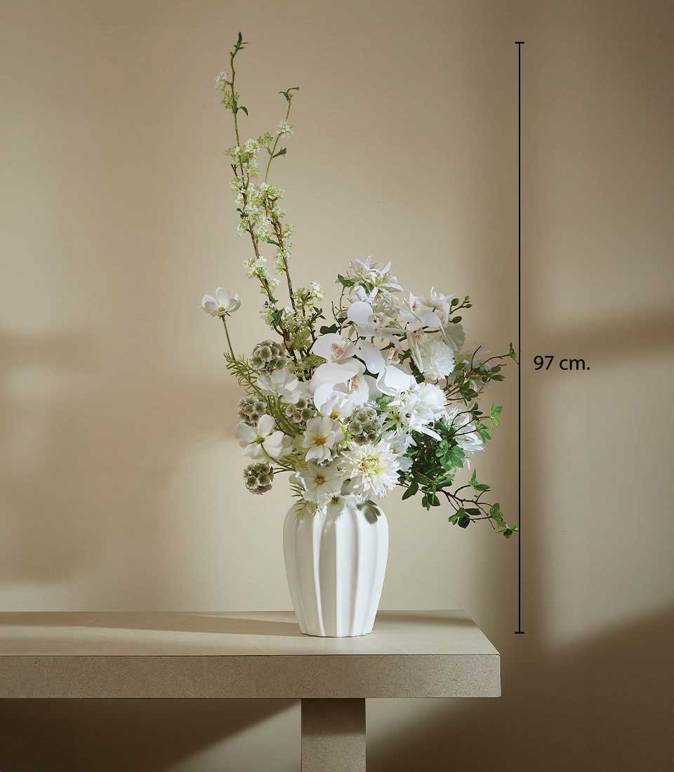 Tall white ceramic vase with cream orchids, dahlias, and foliage arrangement, 97cm height