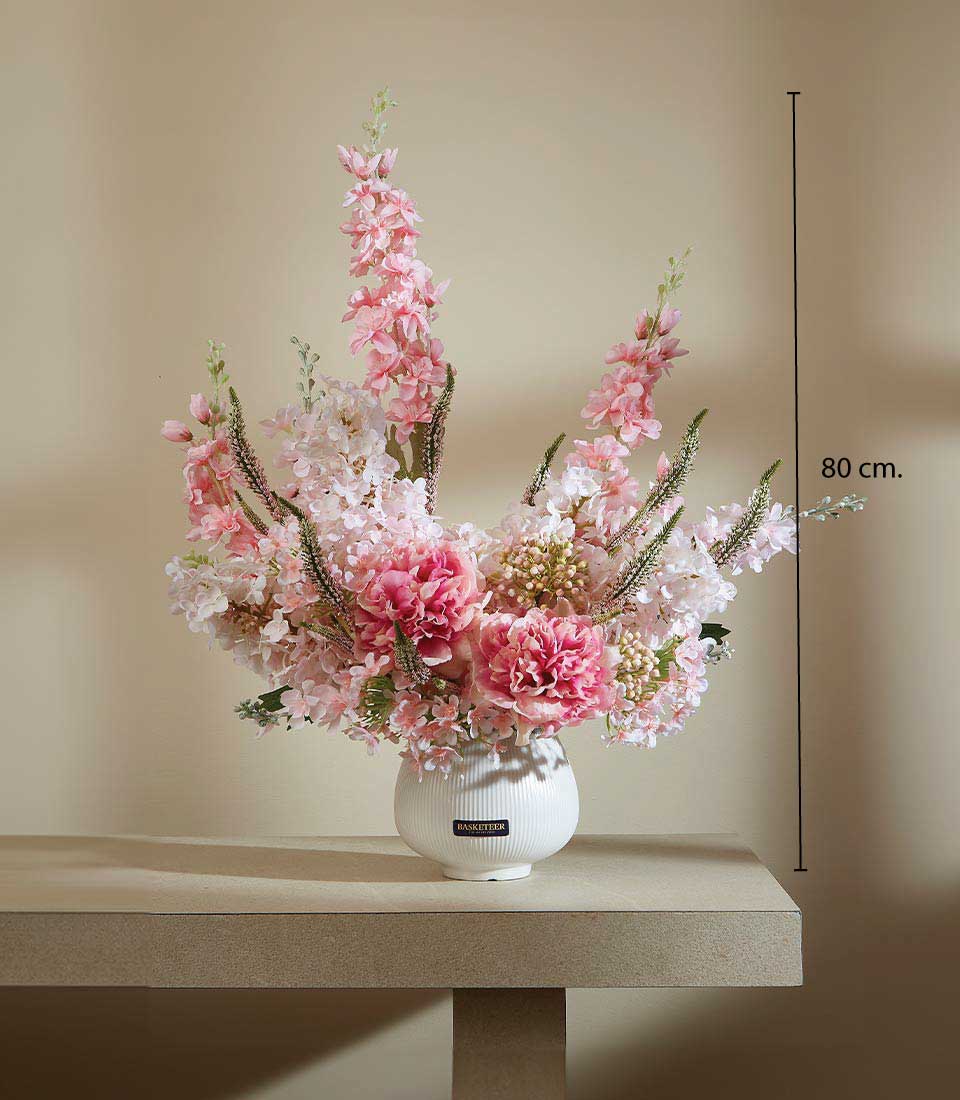 Tall elegant artificial flower arrangement with pink peonies and delphiniums in white ceramic ribbed vase, 80cm height