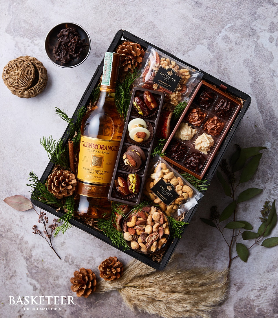 Premium whisky and chocolate gourmet gift basket with roasted nuts and artisan chocolates