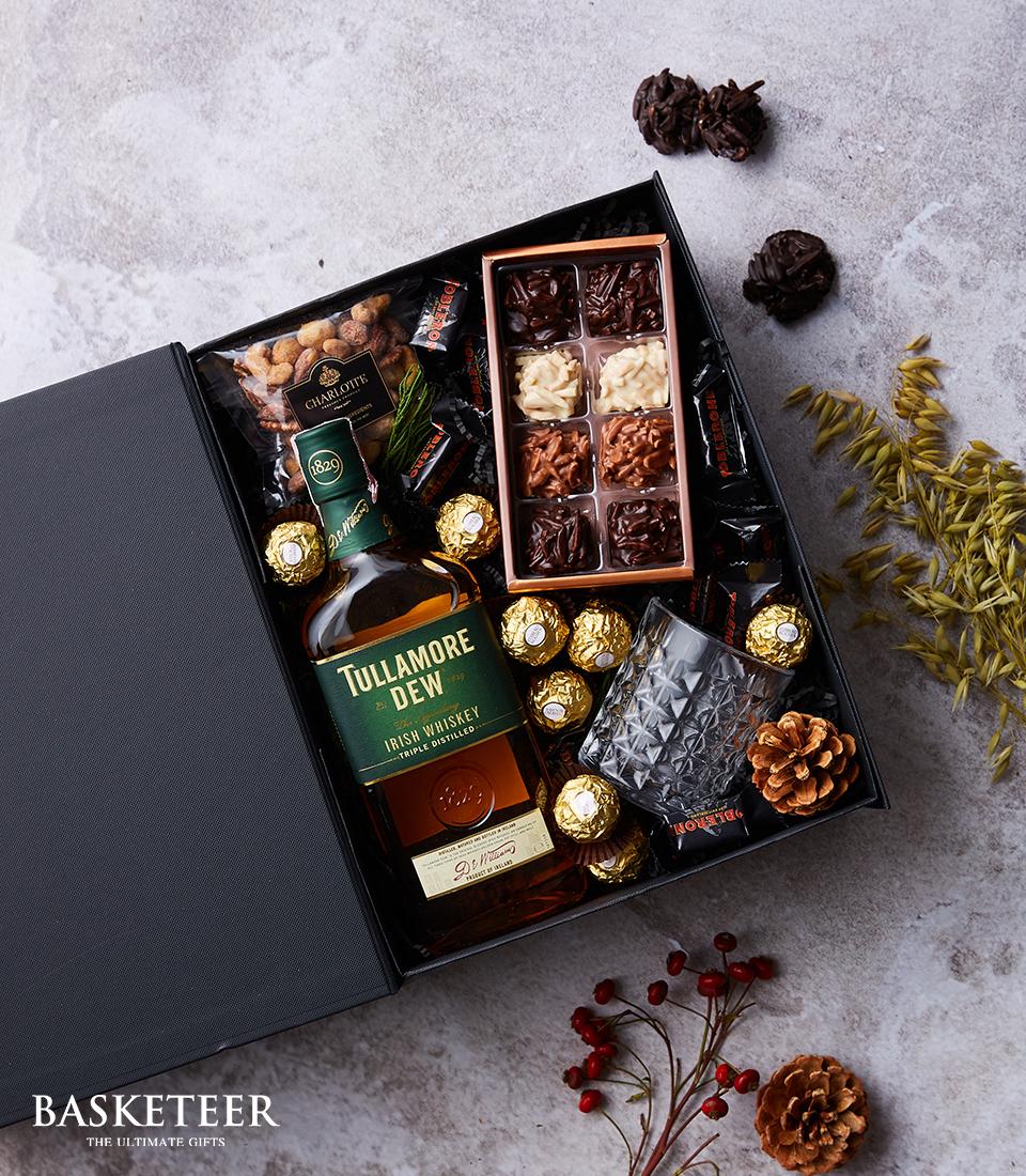 Tullamore Dew Irish Whiskey luxury gift box with faceted glass, chocolates, and nuts in black presentation box