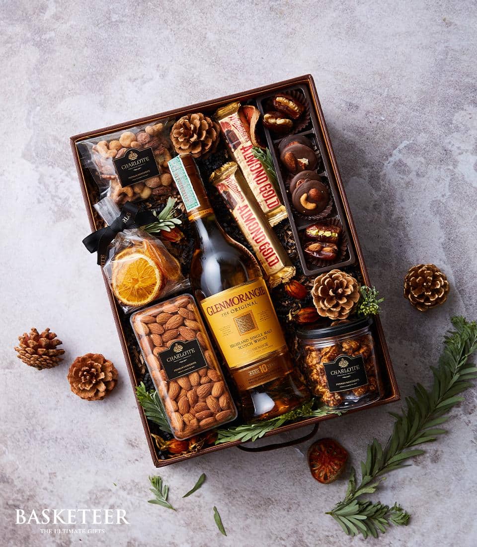 Premium whisky gift box with Glenmorangie Single Malt, artisan chocolates, roasted nuts and gourmet snacks in wooden crate