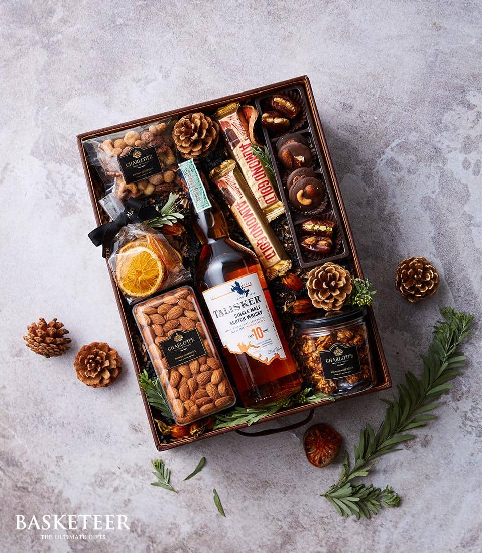 Premium whisky and gourmet gift basket with Talisker Scotch, chocolate, nuts, and dried fruit