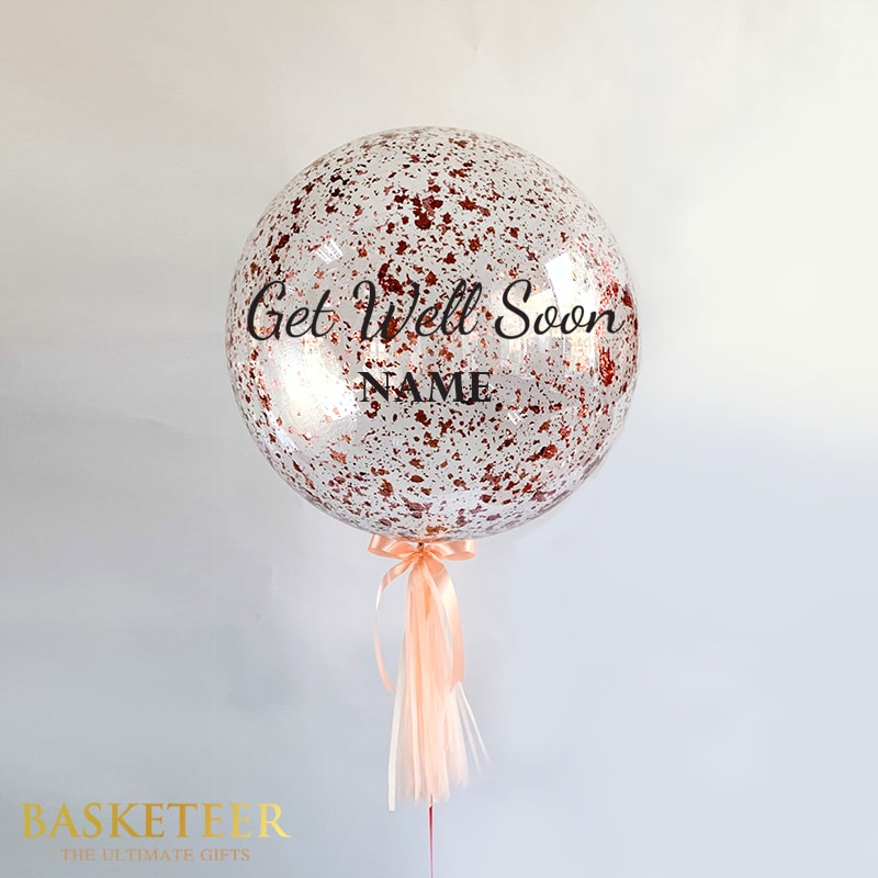 Get Well Soon helium balloon with rose gold confetti and peach satin ribbon