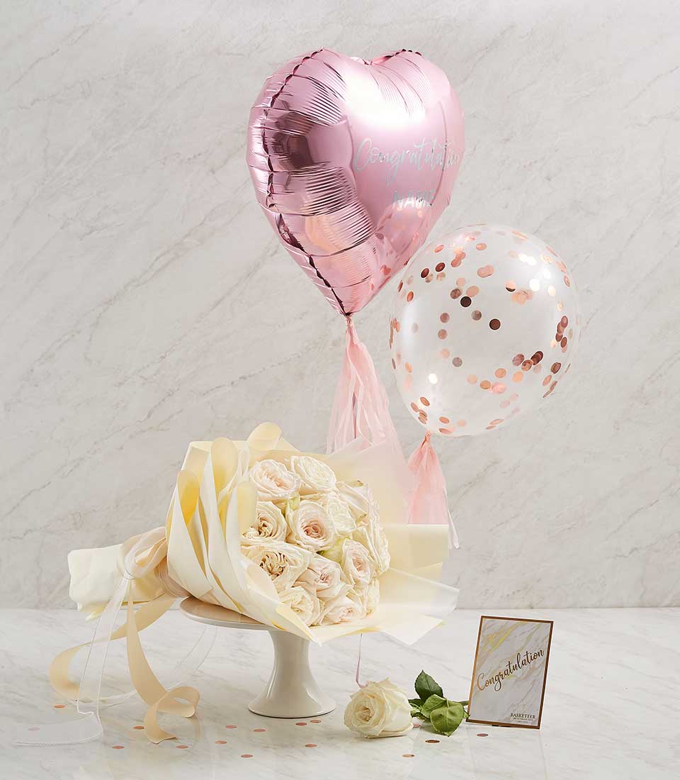 Pink rose bouquet with heart balloon and confetti for celebrations