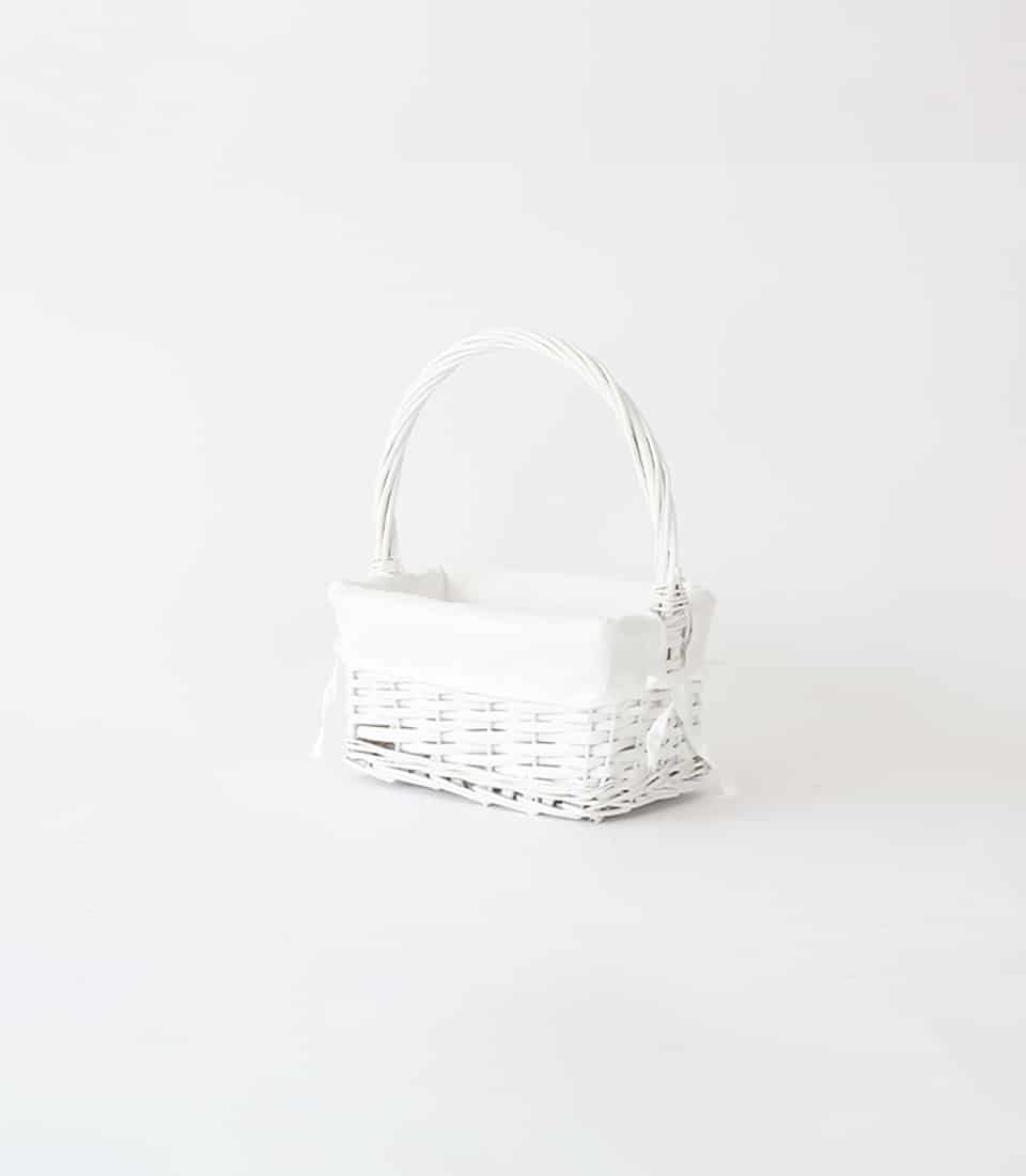 White wicker gift basket with removable liner and ribbon bow, empty luxury hamper base
