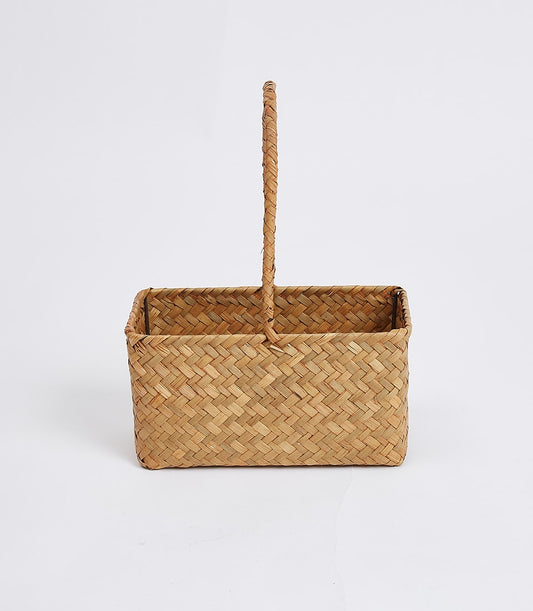 Woven straw gift basket with braided handles, natural tan and light brown weave