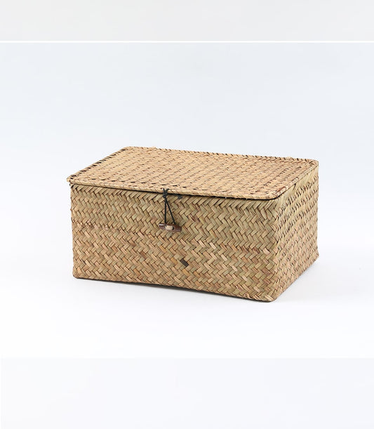 Woven seagrass storage basket with wooden toggle closure in natural tan