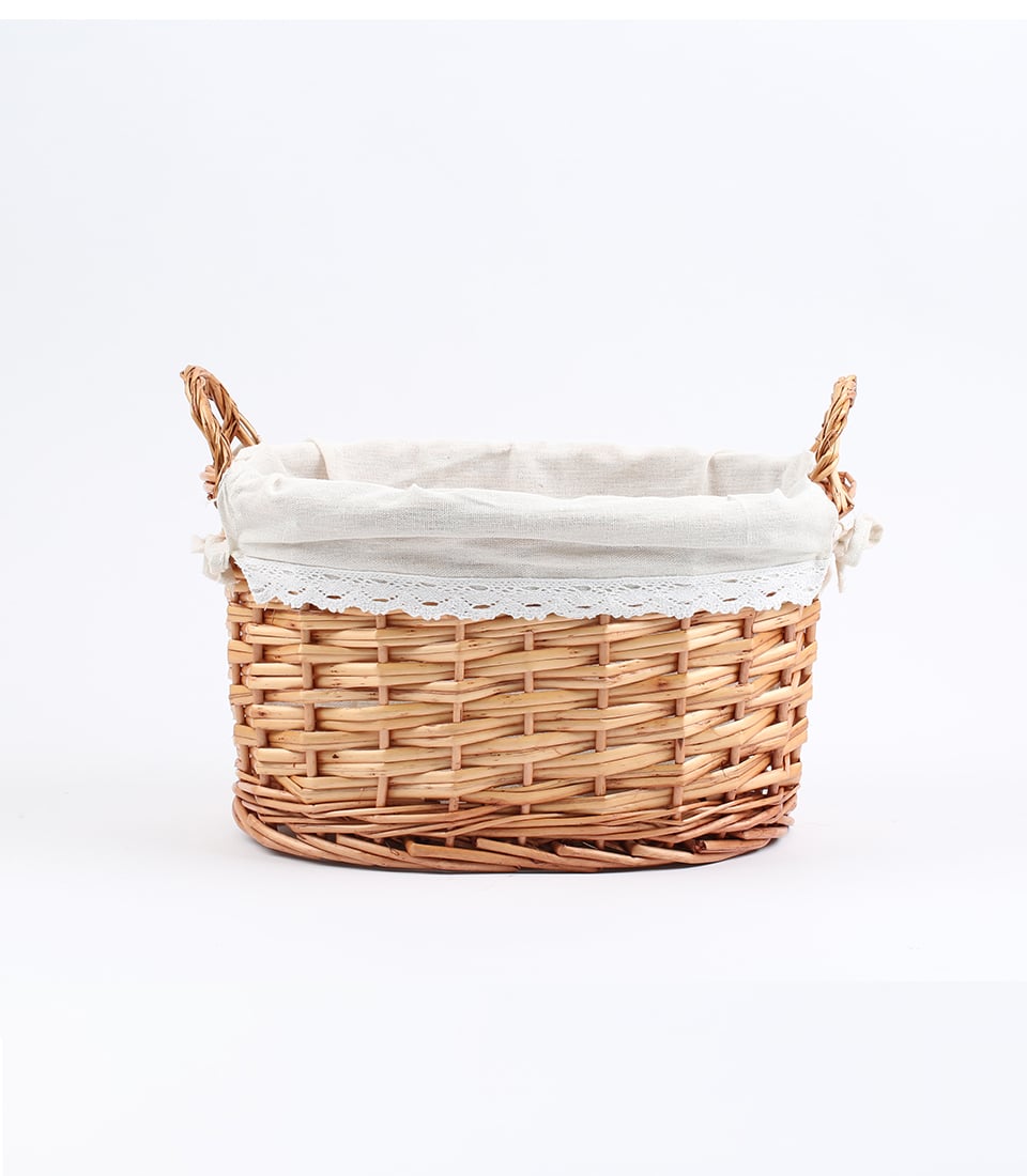 Light brown wicker basket with linen liner and lace trim, dual handles for gifting