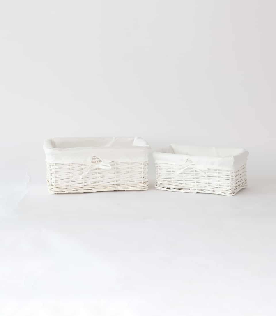White wicker gift baskets with fabric lining and ribbon bows, set of two sizes