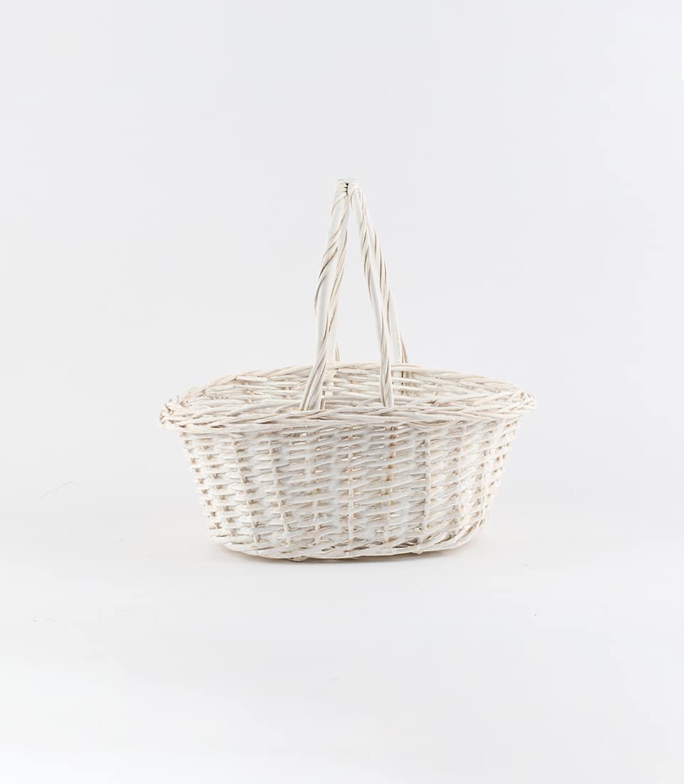 Oval wicker basket with handles, light natural weave, ready for custom gift curation
