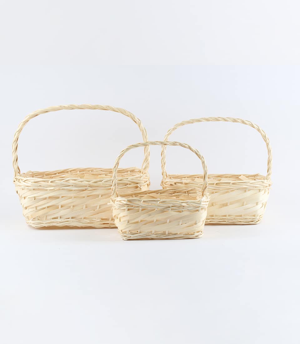 Natural wicker oblong willow baskets in three sizes, handwoven with braided handles for premium gift hampers