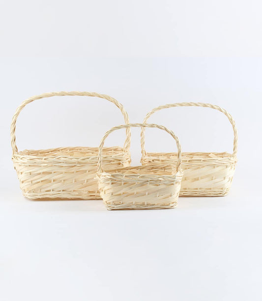 Natural wicker oblong willow baskets in three sizes, handwoven with braided handles for premium gift hampers