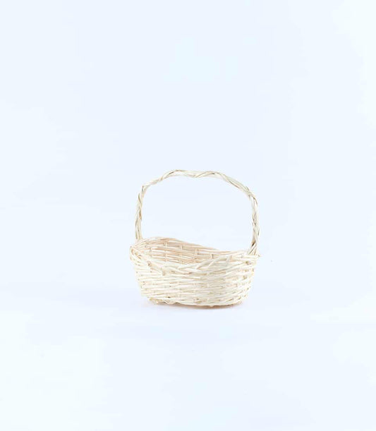 Woven light beige wicker basket with arched handle for luxury gift presentation