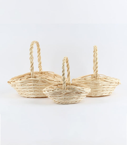 Natural wicker gift baskets in three sizes with woven handles, ready for luxury hamper curation