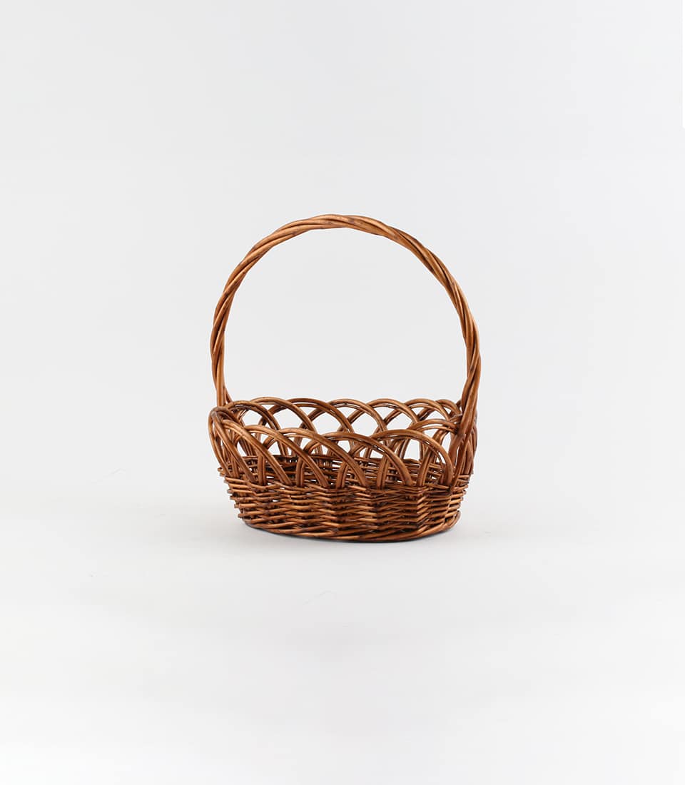 Dark brown wicker gift basket with curved handle, handcrafted willow weave