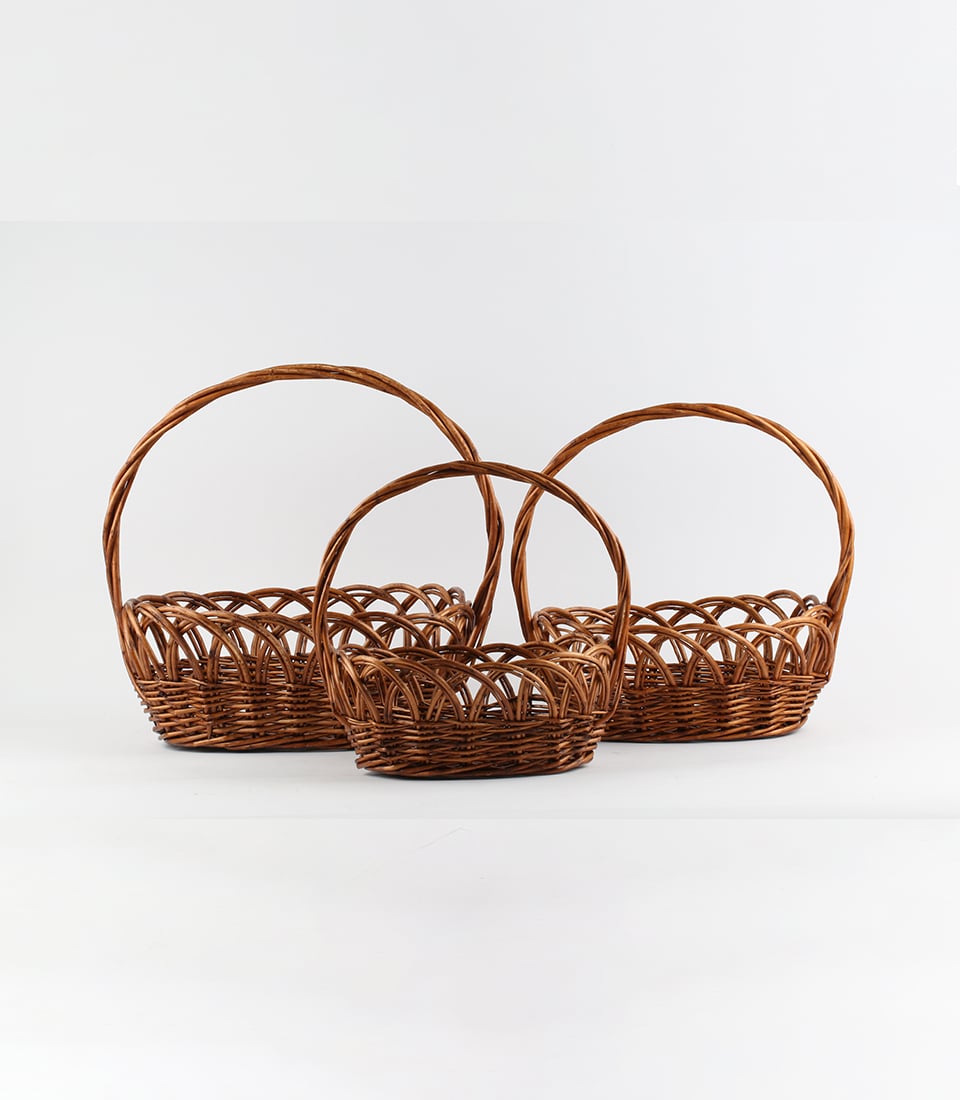 Nested dark brown wicker baskets with arched handles, perfect for custom gift curation