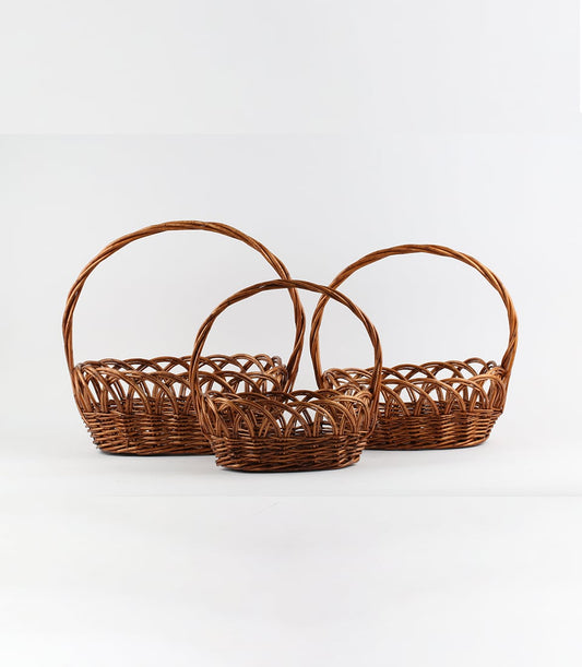 Nested dark brown wicker baskets with arched handles, perfect for custom gift curation