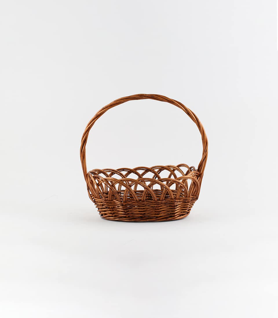 Dark brown wicker basket with braided handle, ready for custom gifting