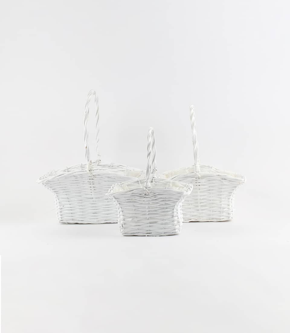 Three white wicker gift baskets with twisted handles, arranged by size for luxury hamper curation