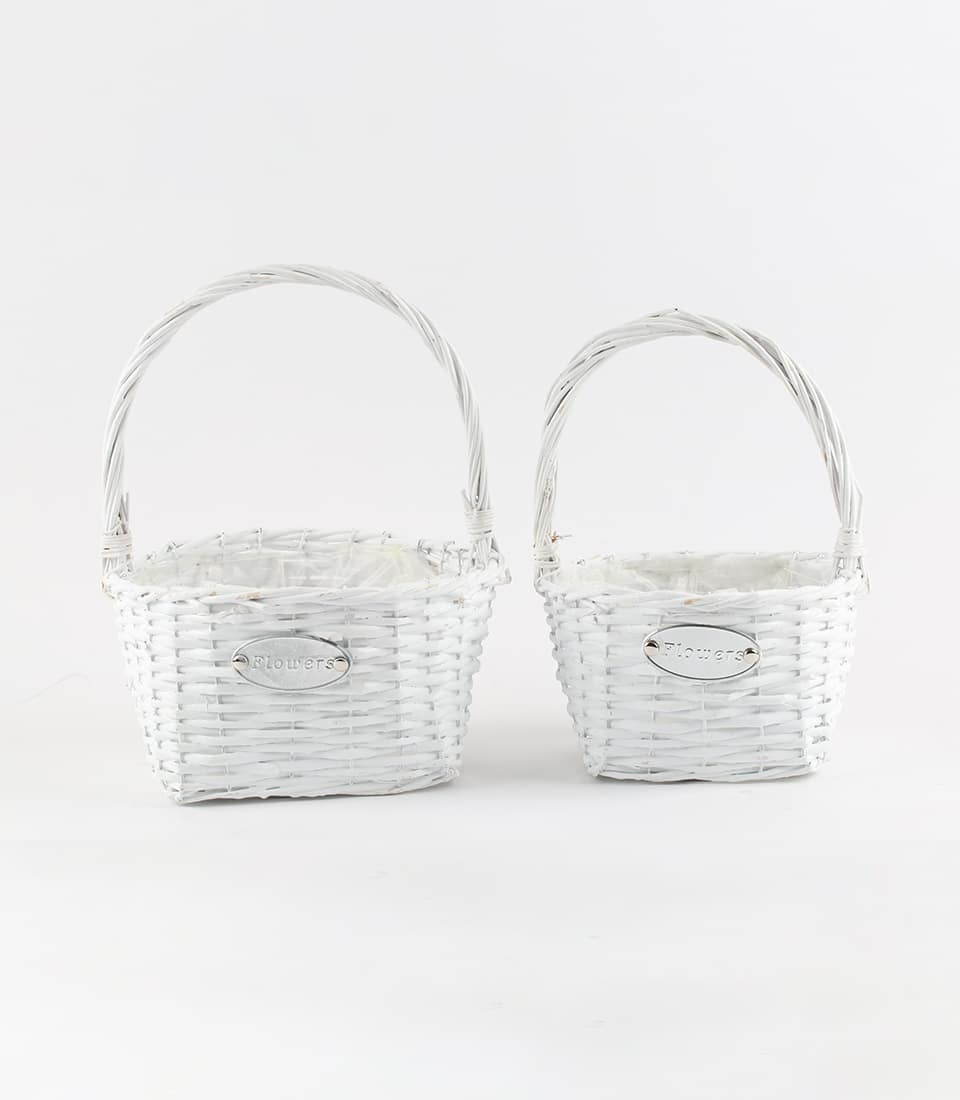 White wicker gift baskets with handles and silver nameplate, ready for custom gifting