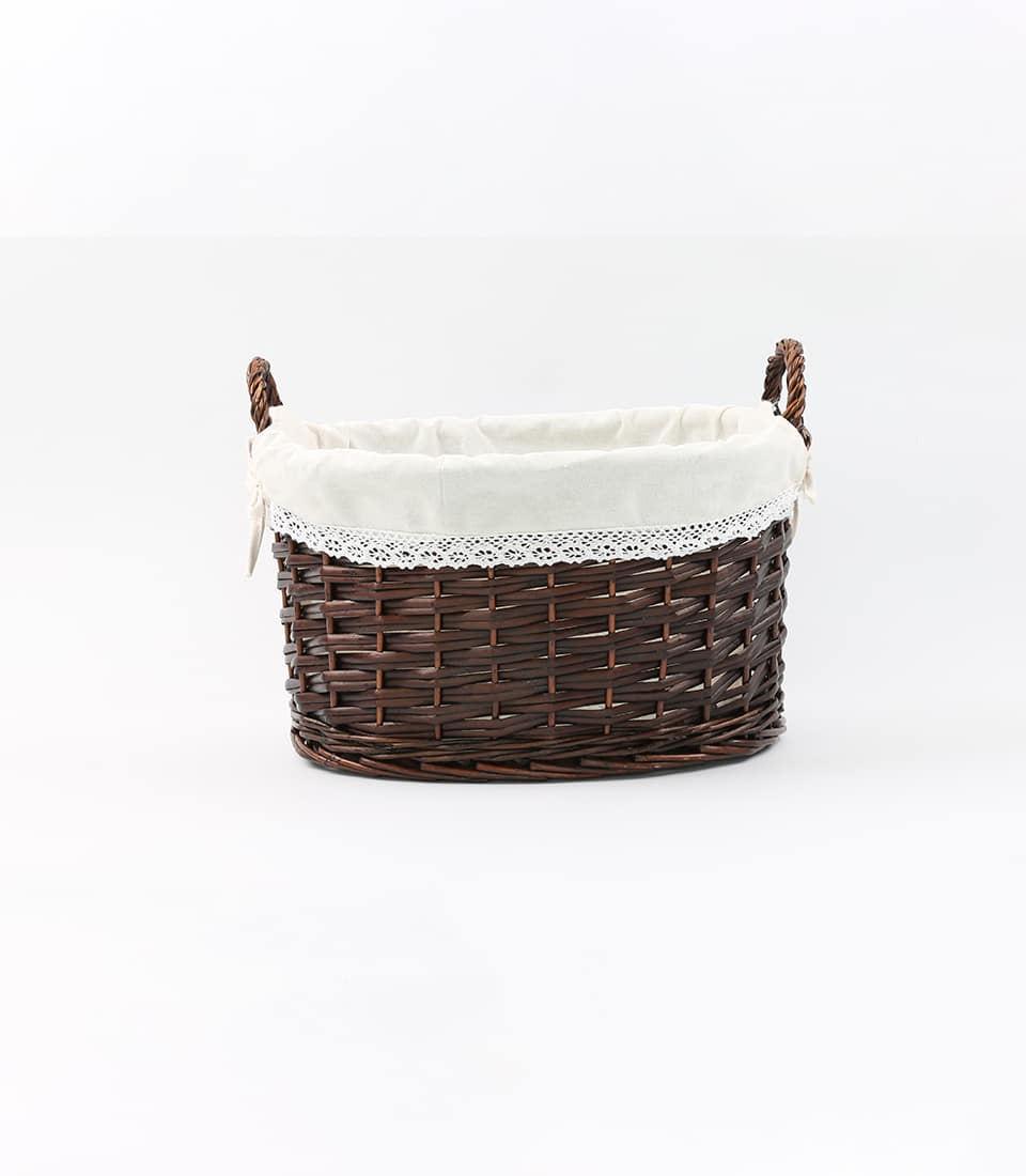 Dark brown woven wicker gift basket with cream linen and lace trim, ready to fill