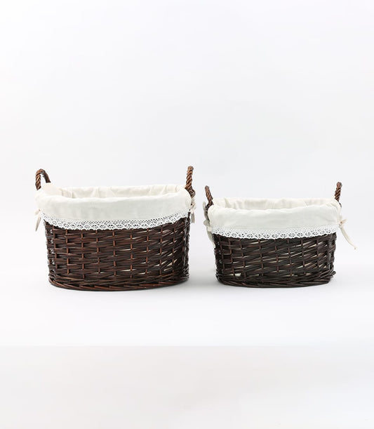 Dark brown wicker gift baskets with cream lace liners and fabric bows, ready to fill