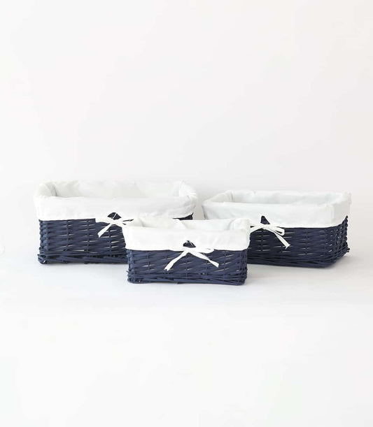 Navy blue rattan baskets with white fabric lining and ribbon bows, set of three sizes for gifting