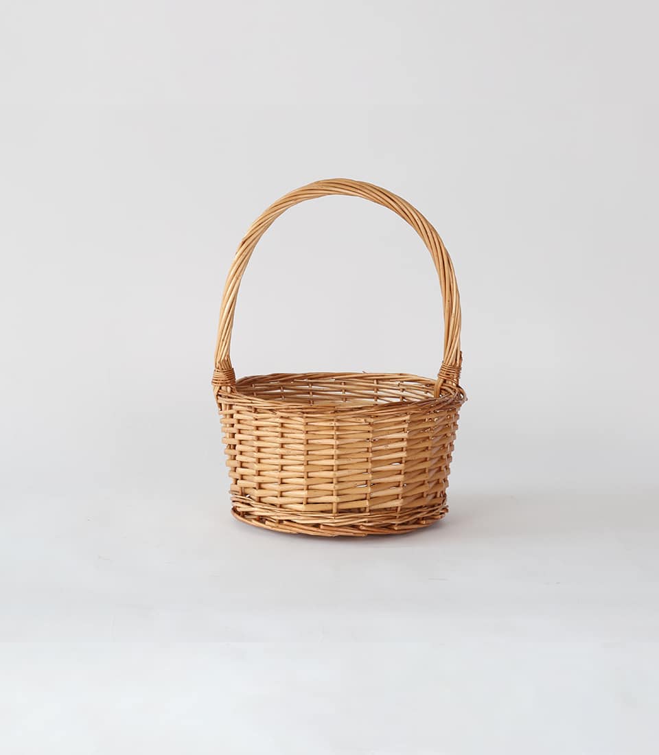 Light brown wicker hamper with handle, open-weave artisan basket for premium gift presentation