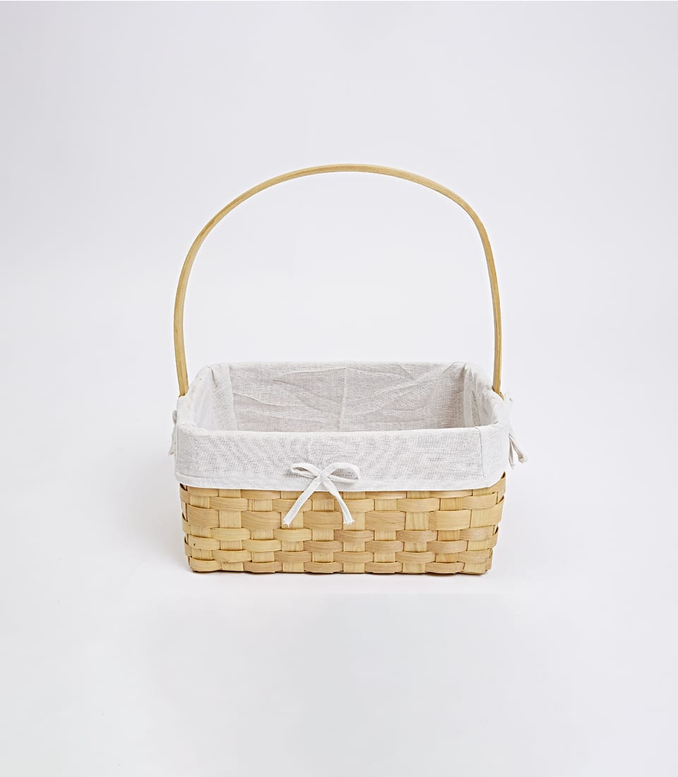Light woven wooden gift basket with soft beige cloth interior and arched handle