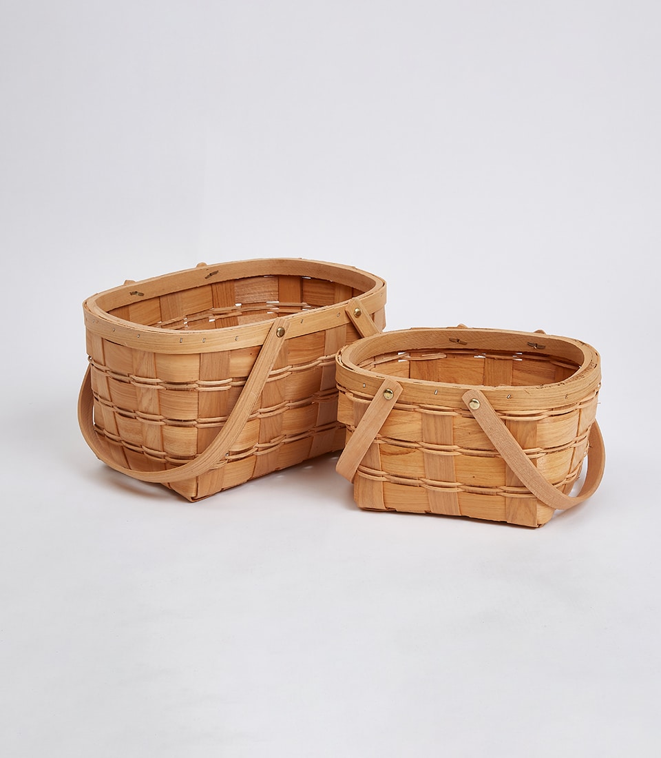 Light woven wooden gift baskets with handles in natural tan, premium artisan construction for luxury gifting