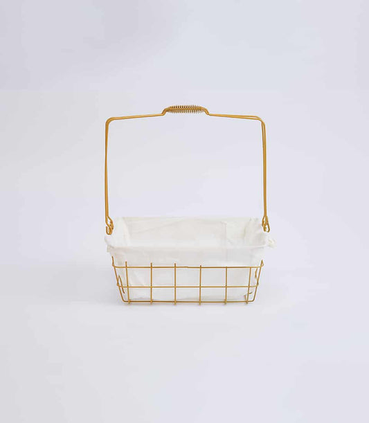 Gold wire basket with white fabric liner and coiled handle, minimalist design for gifting