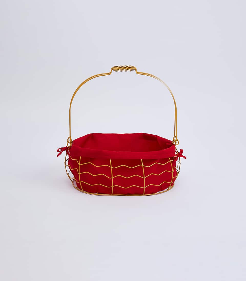 Gold wire basket with red fabric liner and decorative bows, perfect for premium gift presentation