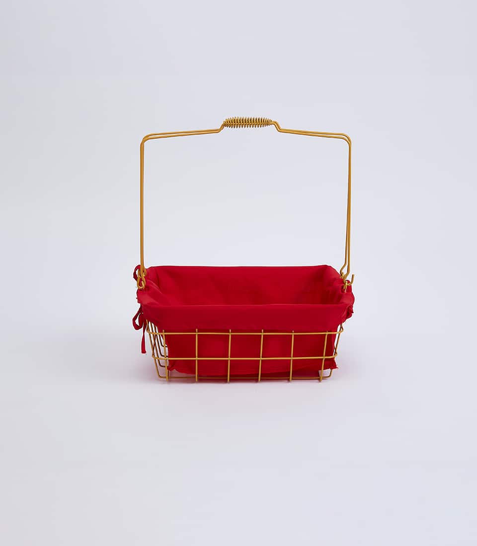 Gold wire basket with removable red fabric liner and spring handle for elegant gift presentation