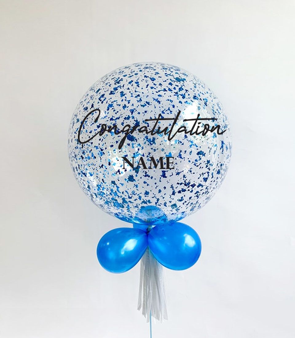 Blue congratulations confetti balloon with personalised name, paired with smaller balloons and white tassel