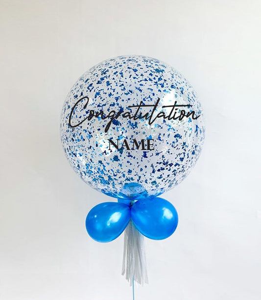 Blue congratulations confetti balloon with personalised name, paired with smaller balloons and white tassel