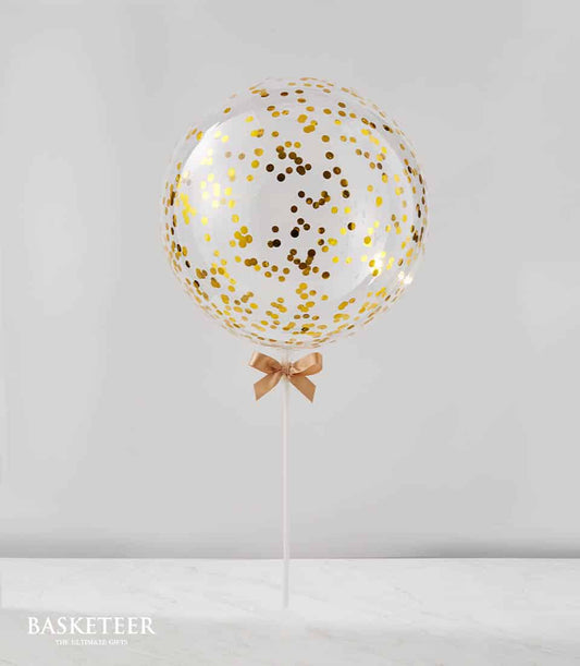 Gold confetti balloon with ribbon bow on stick for celebrations