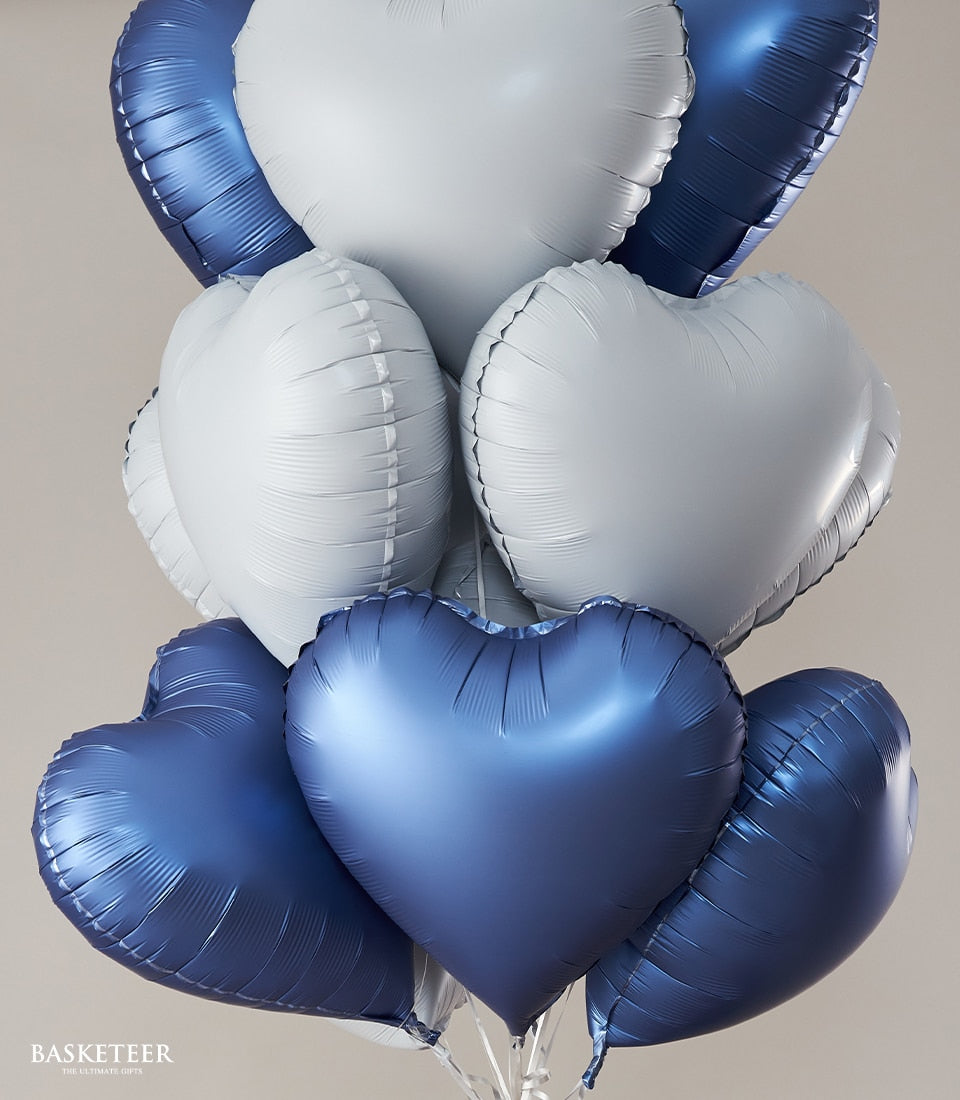 Blue heart-shaped foil balloons bouquet with silver accents, romantic birthday gift set