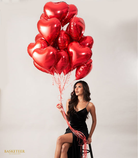Red heart-shaped foil balloons floating bouquet for romantic celebrations and birthday gifts