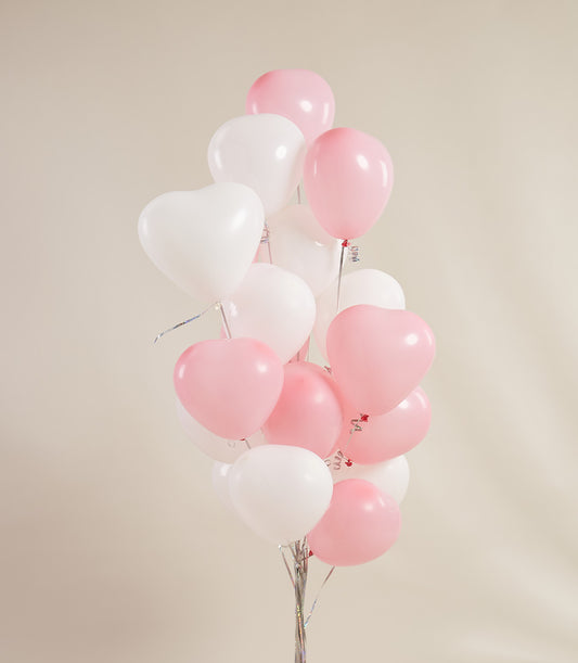 Pink and white heart-shaped helium balloons with silver ribbons, romantic balloon gift set