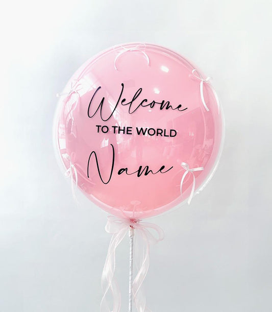Twinkle Twinkle Little Star clear bubble balloon with pink inner balloon, white ribbon bows, and personalisable welcome