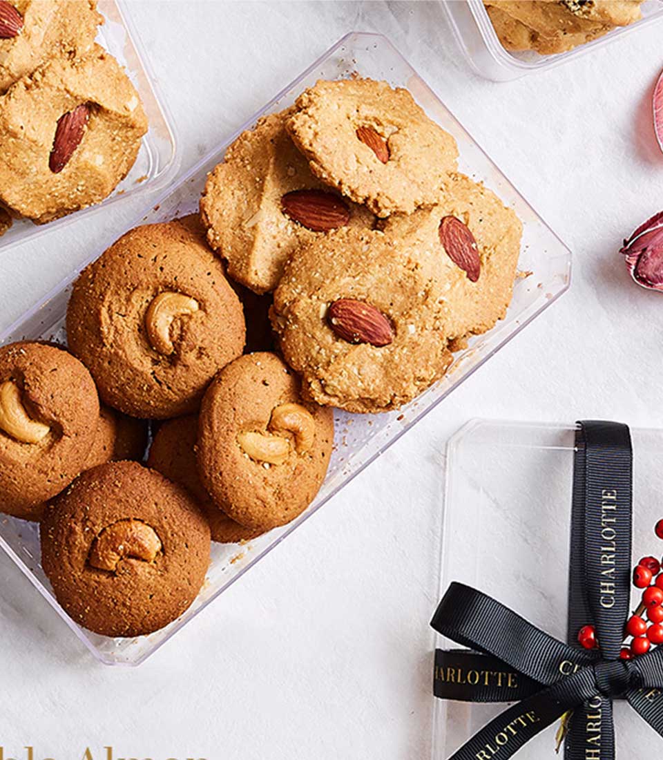 Almond and oatmeal cookies in clear gift boxes with black ribbon, artisan Basketeer bakery assortment