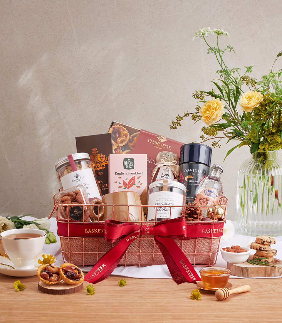Luxury coffee, cookies & salted caramel nut gift hamper with rose gold basket, red ribbon & ceramic mug