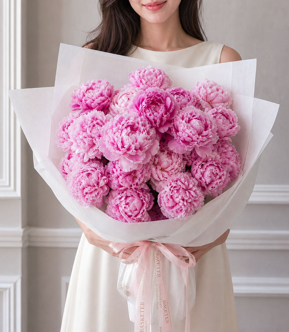Lush pink peony bouquet from Flowers by Basketeer, beautifully wrapped in white paper