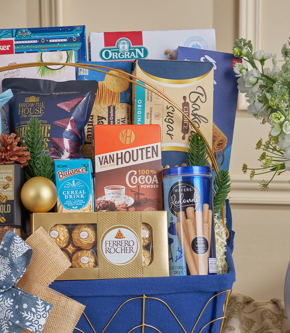 Deep blue luxury gourmet basket with chocolates, wafers, and artisan treats for New Year gifting