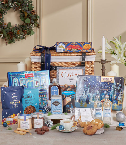 Luxurious blue wicker gift hamper filled with gourmet chocolates, artisan biscuits, specialty coffees and teas, perfect for